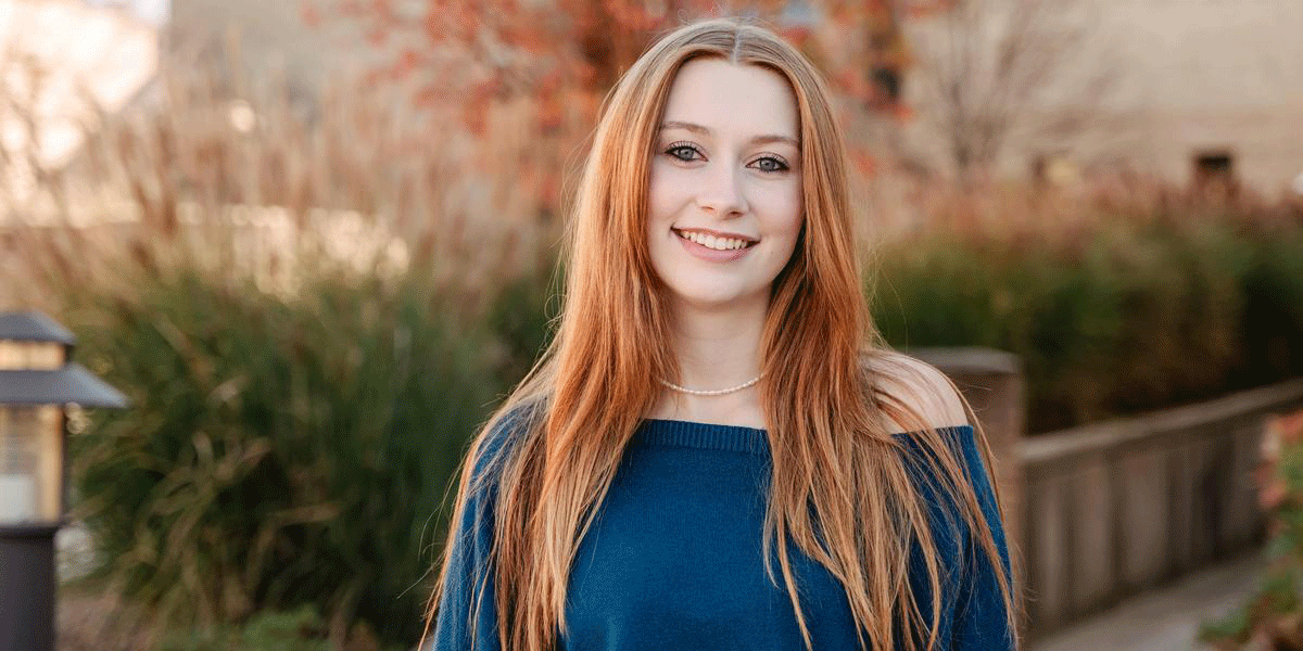 Abby Loftus standing on campus