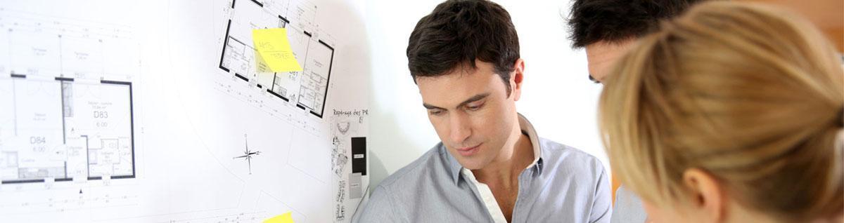 Architecture student discussing blueprint.