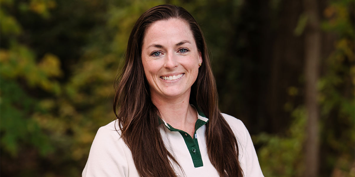 Headshot of Katherine Keough with trees in the background